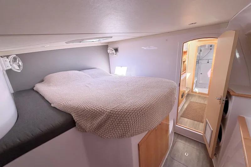 Kestrel Yacht Photos Pics 2020 Seawind 1260 catamaran interior cabin with cozy bed and modern design.