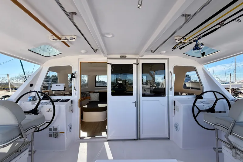 Kestrel Yacht Photos Pics 2020 Seawind 1260 catamaran cockpit with dual steering wheels and modern interior.