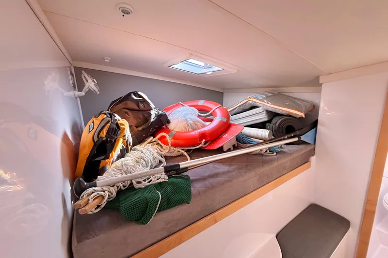 Kestrel Yacht Photos Pics Storage area in 2020 Seawind 1260 yacht with life preserver and gear.