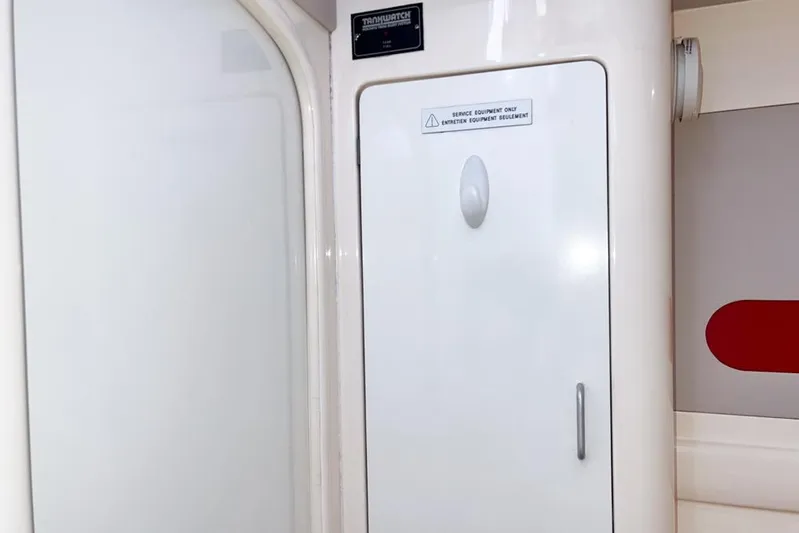 Next Of Kin Yacht Photos Pics Interior of a 2000 Leopard 38 yacht showing a service equipment panel.