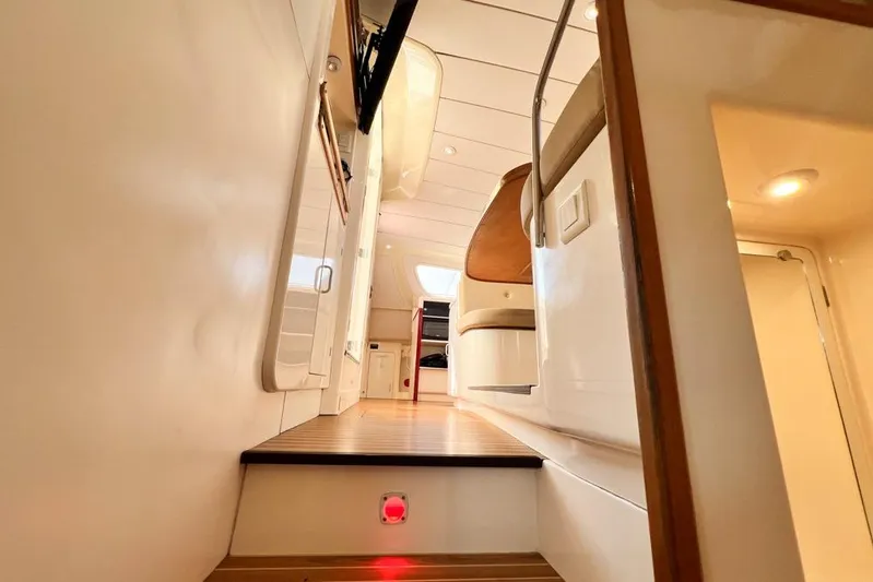 Next Of Kin Yacht Photos Pics Interior of 2000 Leopard 38 yacht, featuring wooden steps and modern design elements.