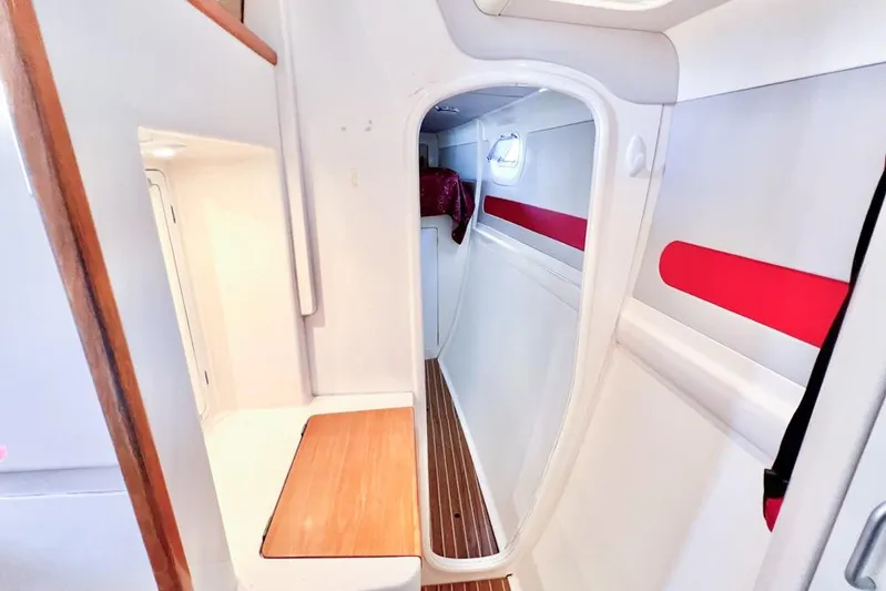 Next Of Kin Yacht Photos Pics Interior of 2000 Leopard 38 catamaran with modern design and wooden flooring.