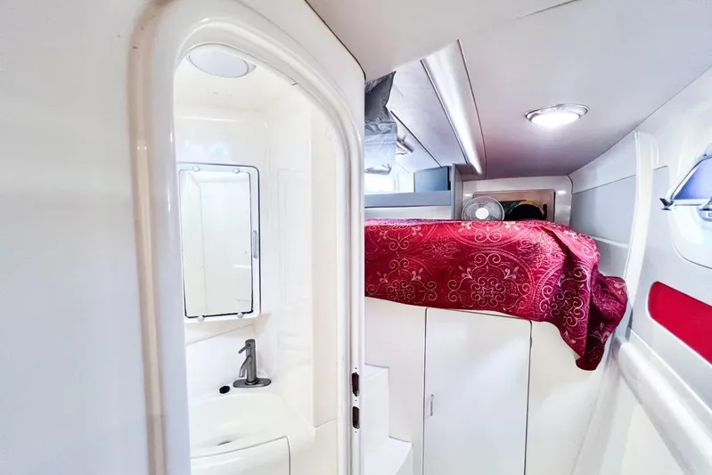 Next Of Kin Yacht Photos Pics Interior of 2000 Leopard 38 yacht with compact bathroom and cozy cabin.