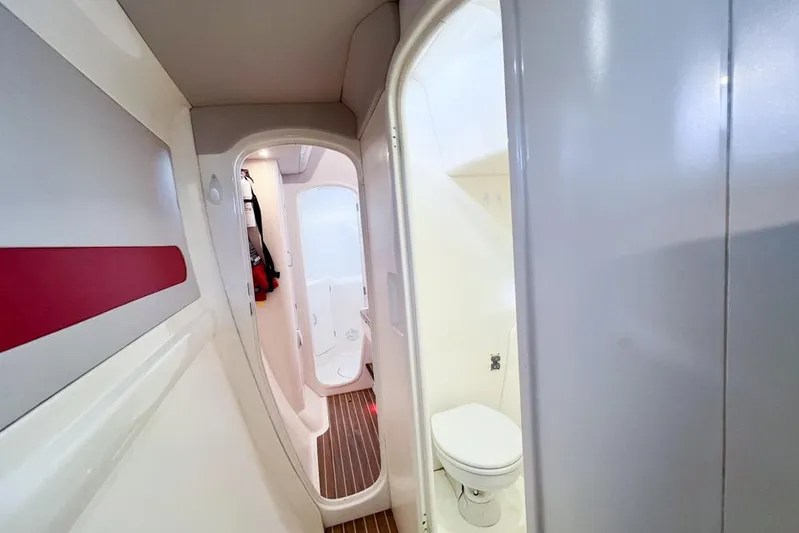 Next Of Kin Yacht Photos Pics Interior of a 2000 Leopard 38 yacht featuring a compact bathroom and hallway.