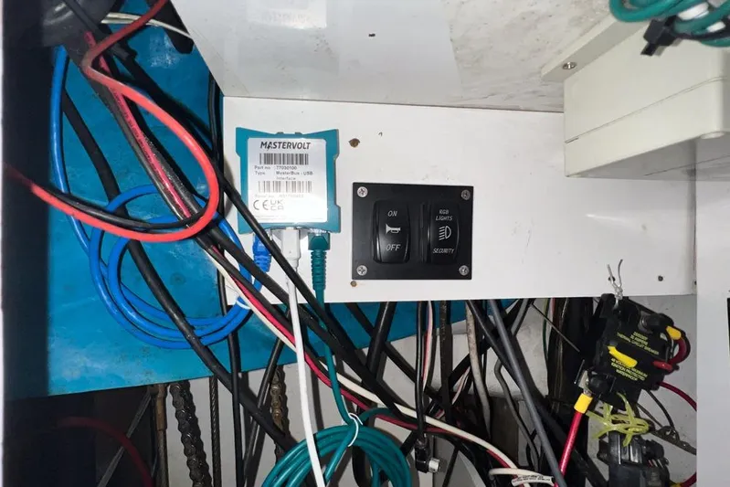 Next Of Kin Yacht Photos Pics Electrical panel with Mastervolt USB, switches, and wiring in a 2000 Leopard 38 model.