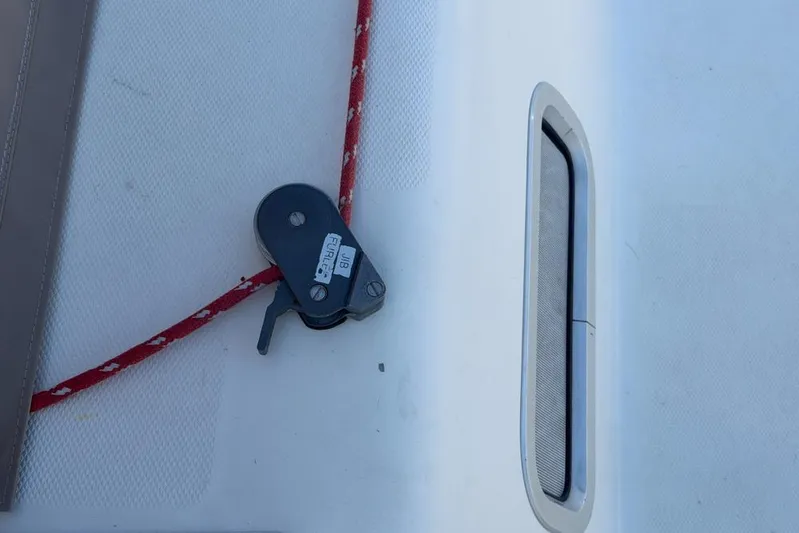 Next Of Kin Yacht Photos Pics Deck of 2000 Leopard 38 with red rope and pulley system.