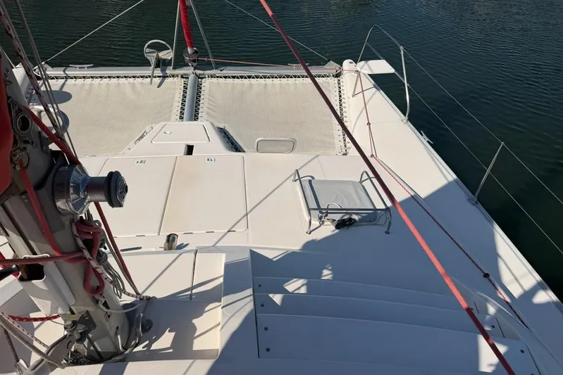 Next Of Kin Yacht Photos Pics Leopard 38 catamaran deck with rigging, 2000 model, on calm water.