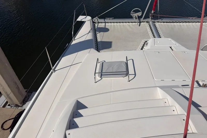 Next Of Kin Yacht Photos Pics Deck view of a 2000 Leopard 38 catamaran, featuring spacious layout and netting.