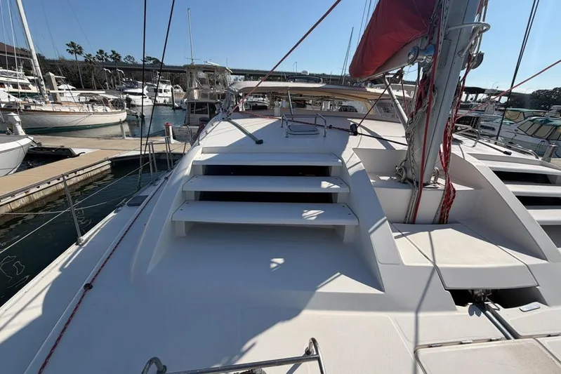 Next Of Kin Yacht Photos Pics Sailboat deck view of 2000 Leopard 38 catamaran in marina setting.