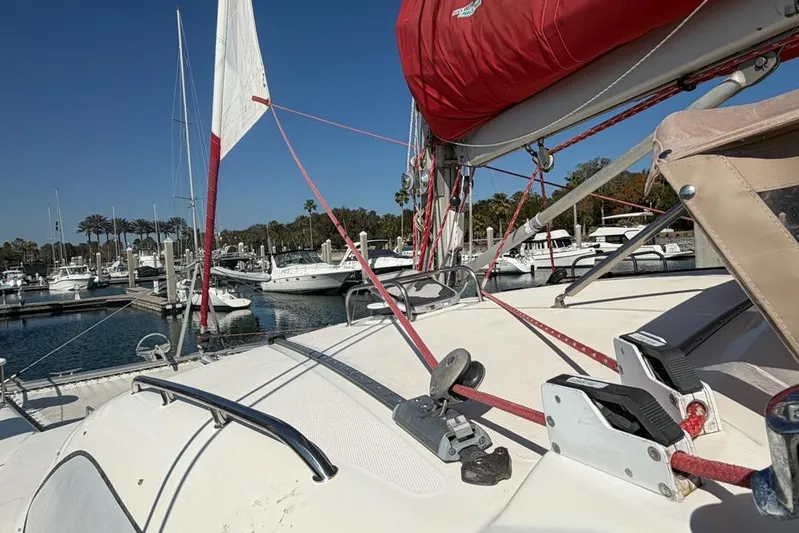 Next Of Kin Yacht Photos Pics Sailboat deck view of a 2000 Leopard 38 catamaran in a marina setting.