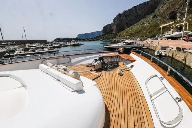 Eacos Yacht Photos Pics Luxury Tecnomar Velvet 90 yacht deck, 2003 model, docked in scenic marina.