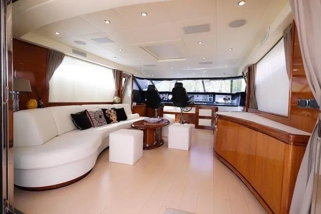 Eacos Yacht Photos Pics Luxurious interior of 2003 Tecnomar Velvet 90 yacht with elegant seating and helm station.