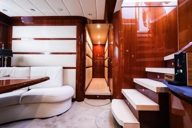 Eacos Yacht Photos Pics Luxurious interior of 2003 Tecnomar Velvet 90 yacht with elegant wood finishes.