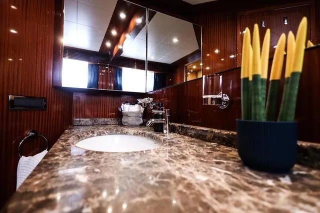 Eacos Yacht Photos Pics Luxurious bathroom interior of 2003 Tecnomar Velvet 90 yacht with marble countertop.
