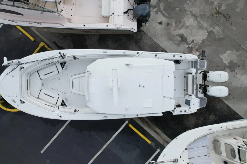  Yacht Photos Pics Aerial view of 2021 Blackfin 332 CC boat docked, showcasing sleek design and twin engines.