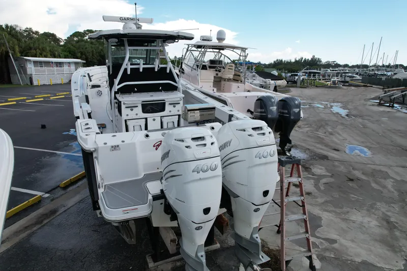  Yacht Photos Pics 2021 Blackfin 332 CC boat with twin Mercury 400 engines at a marina.