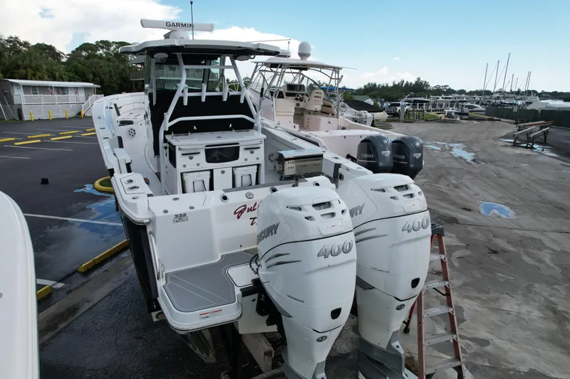  Yacht Photos Pics 2021 Blackfin 332 CC boat with twin Mercury 400 engines at a marina.