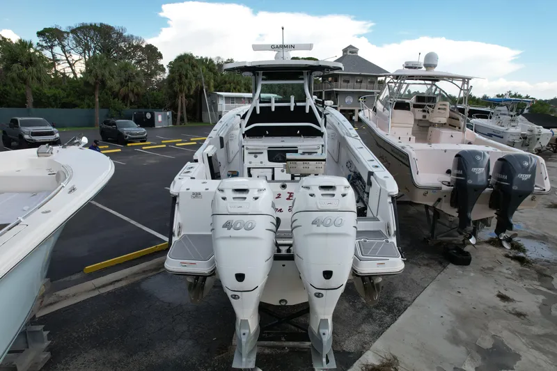  Yacht Photos Pics 2021 Blackfin 332 CC boat with twin 400 horsepower engines in a marina.