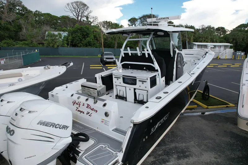  Yacht Photos Pics 2021 Blackfin 332 CC boat with Mercury engines, parked in a lot.