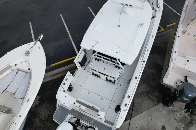  Yacht Photos Pics Overhead view of a 2021 Blackfin 332 CC boat in a parking area.