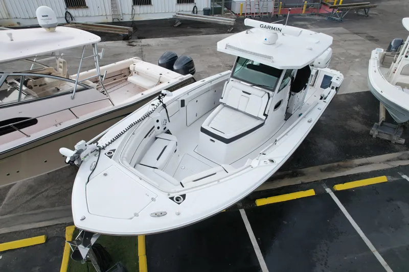  Yacht Photos Pics 2021 Blackfin 332 CC boat with Garmin equipment, docked in a marina.