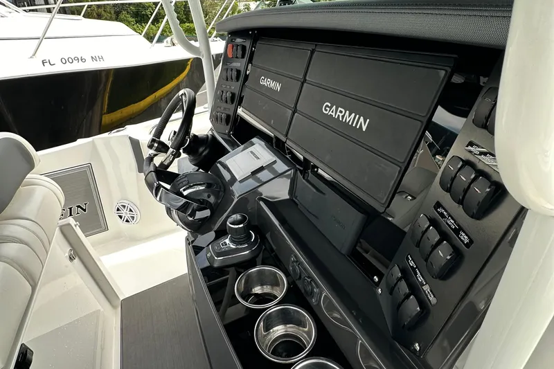  Yacht Photos Pics 2021 Blackfin 332 CC boat dashboard with Garmin displays and control panel.