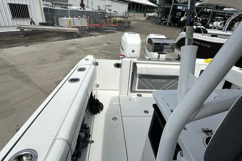  Yacht Photos Pics 2021 Blackfin 332 CC boat interior with dual engines and seating area.