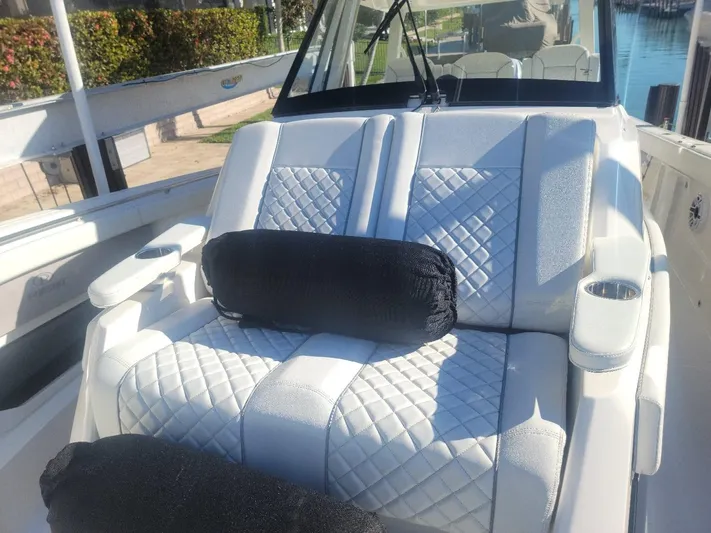  Yacht Photos Pics 2021 Pursuit S 378 Sport boat with luxurious white quilted seating.