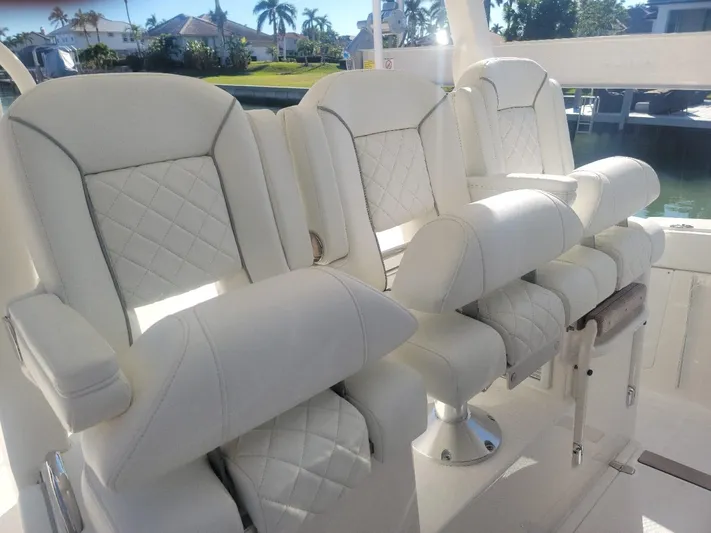  Yacht Photos Pics Luxurious white seating on 2021 Pursuit S 378 Sport boat.