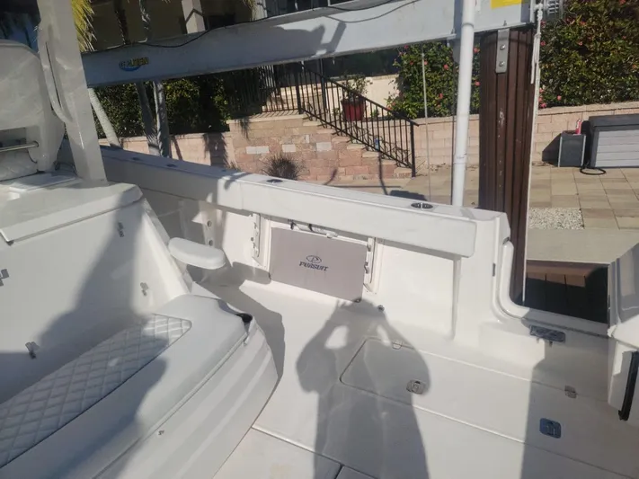  Yacht Photos Pics 2021 Pursuit S 378 Sport boat interior with seating and storage.
