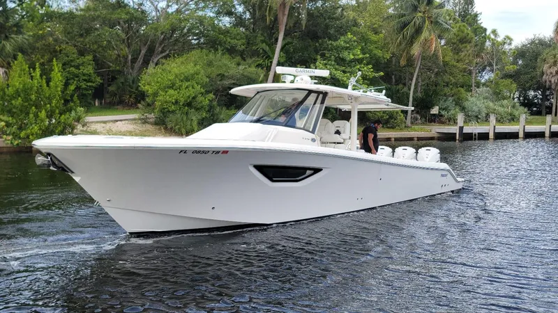  Yacht Photos Pics 2021 Pursuit S 378 Sport boat cruising on a calm river.
