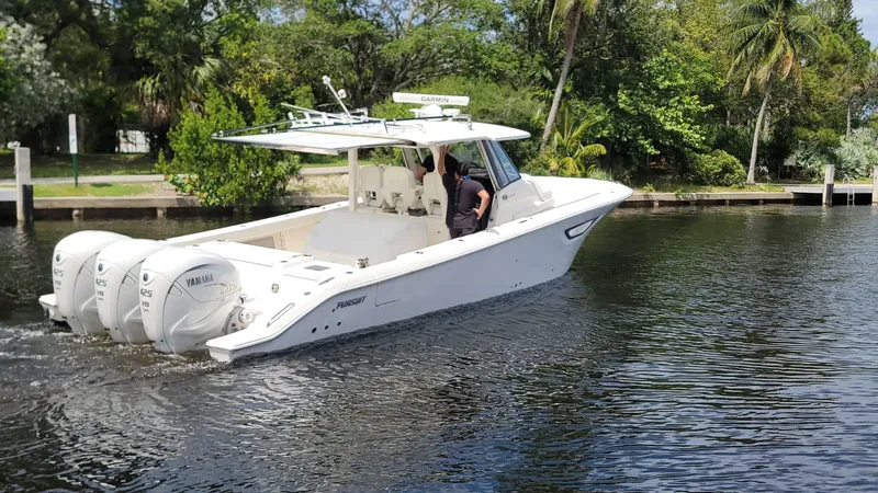  Yacht Photos Pics 2021 Pursuit S 378 Sport boat cruising on a calm river.