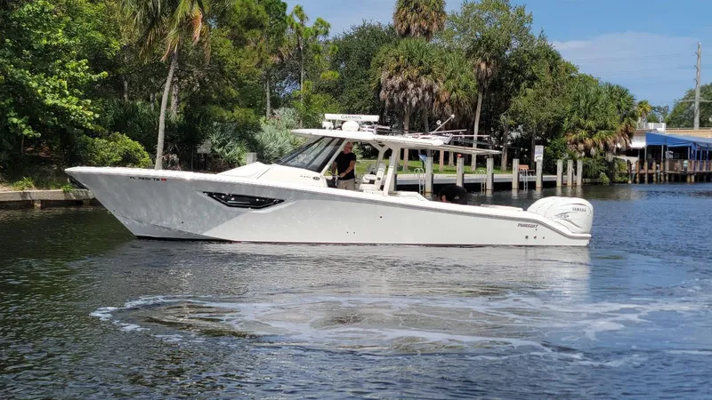  Yacht Photos Pics 2021 Pursuit S 378 Sport boat cruising on a calm river.