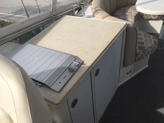 Silver Lining Yacht Photos Pics 2005 Marquis Fly Bridge interior with countertop and seating area.