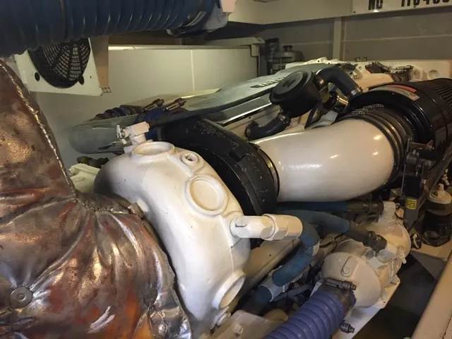 Silver Lining Yacht Photos Pics 2005 Marquis Fly Bridge engine compartment with visible components and hoses.