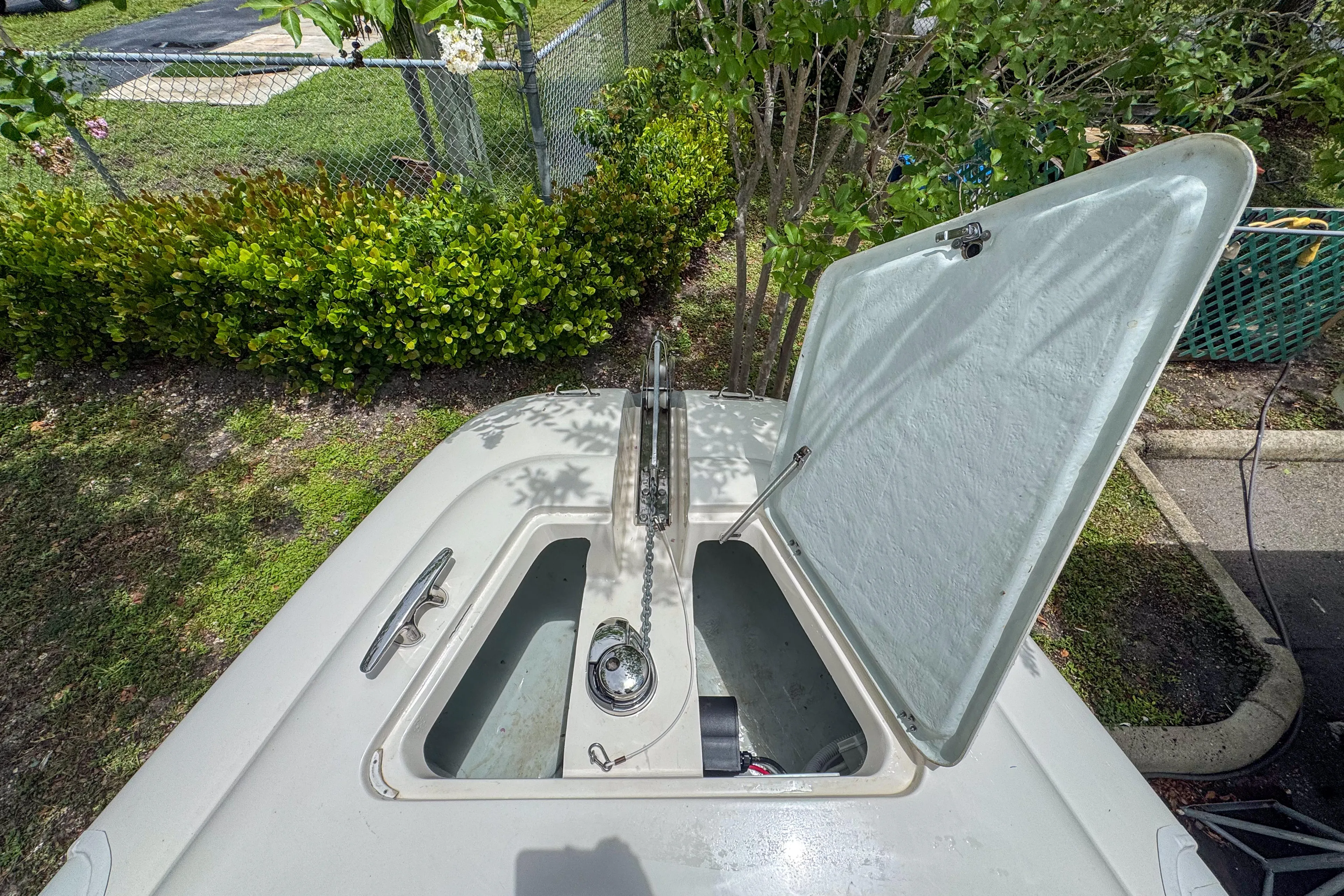  Yacht Photos Pics Open hatch on 2023 Tender Impertus 36 boat, showing storage compartment.