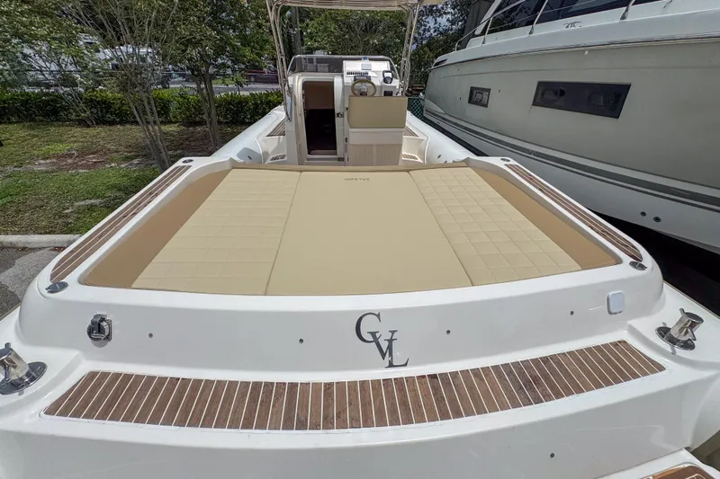  Yacht Photos Pics 2023 Tender Impertus 36 boat with spacious deck and luxurious seating.