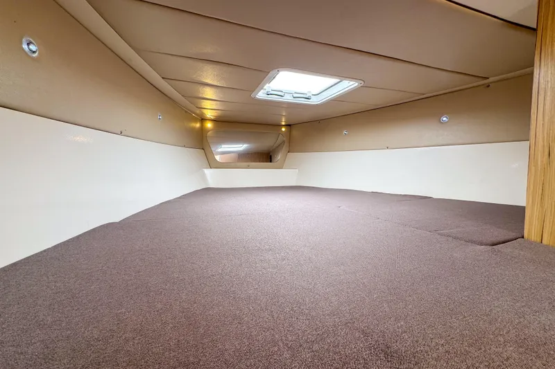  Yacht Photos Pics Interior cabin of 2023 Tender Impertus 36 with skylight and brown carpeting.