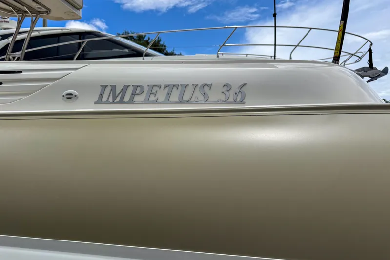  Yacht Photos Pics 2023 Tender Impertus 36 boat side view with clear branding.