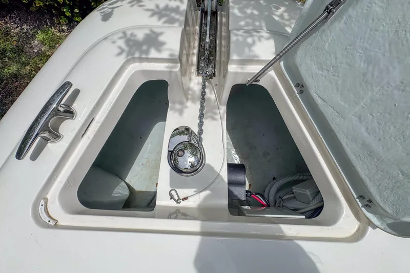  Yacht Photos Pics Open hatch of 2023 Tender Impertus 36 boat, showing anchor chain and storage compartment.