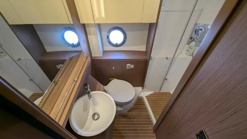 Best Life Yacht Photos Pics Luxurious bathroom interior of 2019 Beneteau GT 46 yacht with modern fixtures.