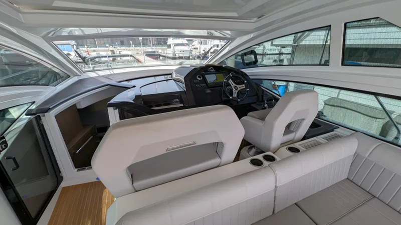 Best Life Yacht Photos Pics Interior of 2019 Beneteau GT 46 yacht with modern helm and seating area.