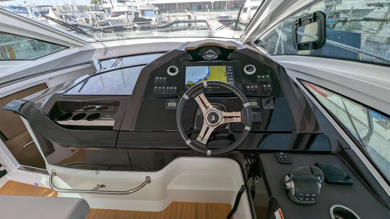 Best Life Yacht Photos Pics 2019 Beneteau GT 46 helm with modern navigation controls and sleek design.