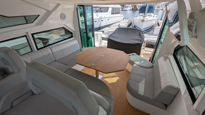 Best Life Yacht Photos Pics Interior of 2019 Beneteau GT 46 yacht with spacious seating and table.