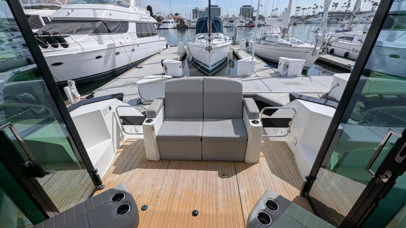 Best Life Yacht Photos Pics 2019 Beneteau GT 46 yacht interior with seating, docked at marina.