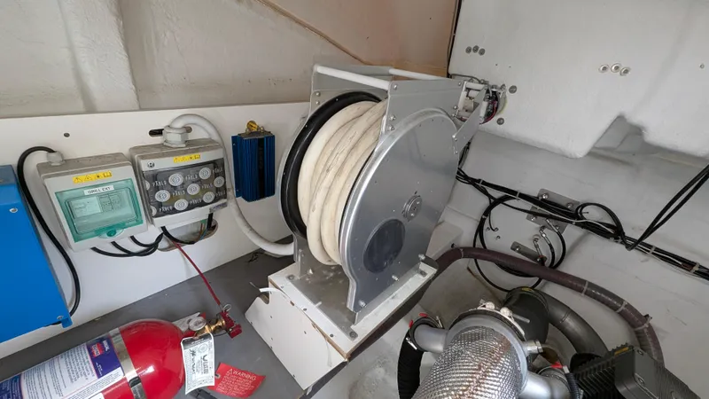 Best Life Yacht Photos Pics Engine room of 2019 Beneteau GT 46 with hose reel and fire extinguisher.