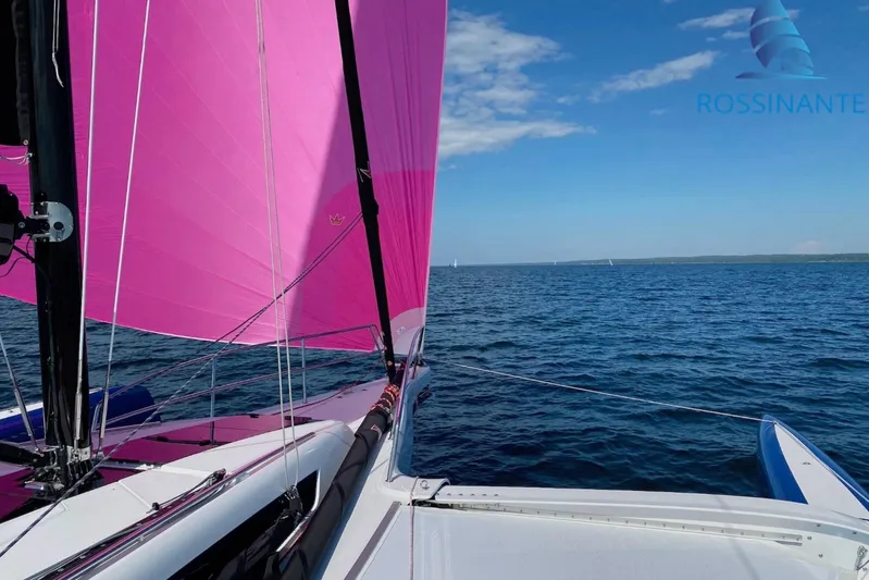  Yacht Photos Pics Sailing on a Dragonfly 40 trimaran with vibrant pink sails, 2021 model.