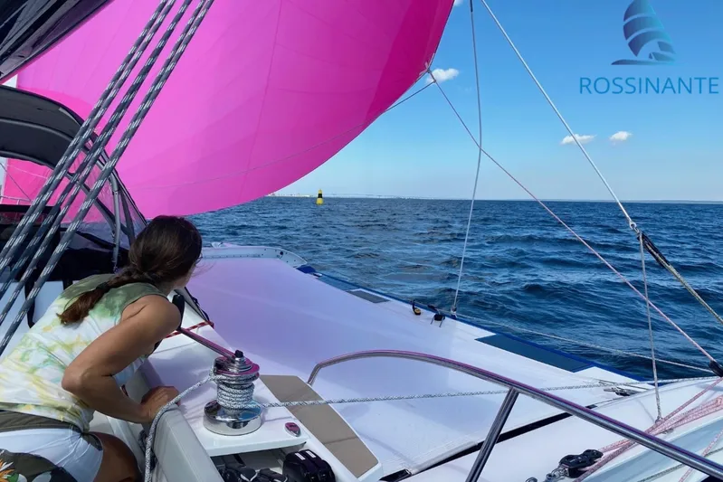  Yacht Photos Pics Sailboat Dragonfly 40 with pink sail on open sea, 2021 model.