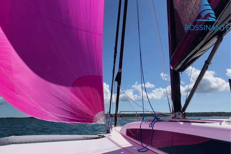 Yacht Photos Pics Sailing yacht Dragonfly 40 with vibrant pink sails on a sunny day, 2021 model.