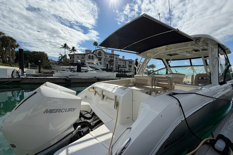  Yacht Photos Pics 2022 Boston Whaler 320 Vantage docked, featuring Mercury engines and spacious seating.